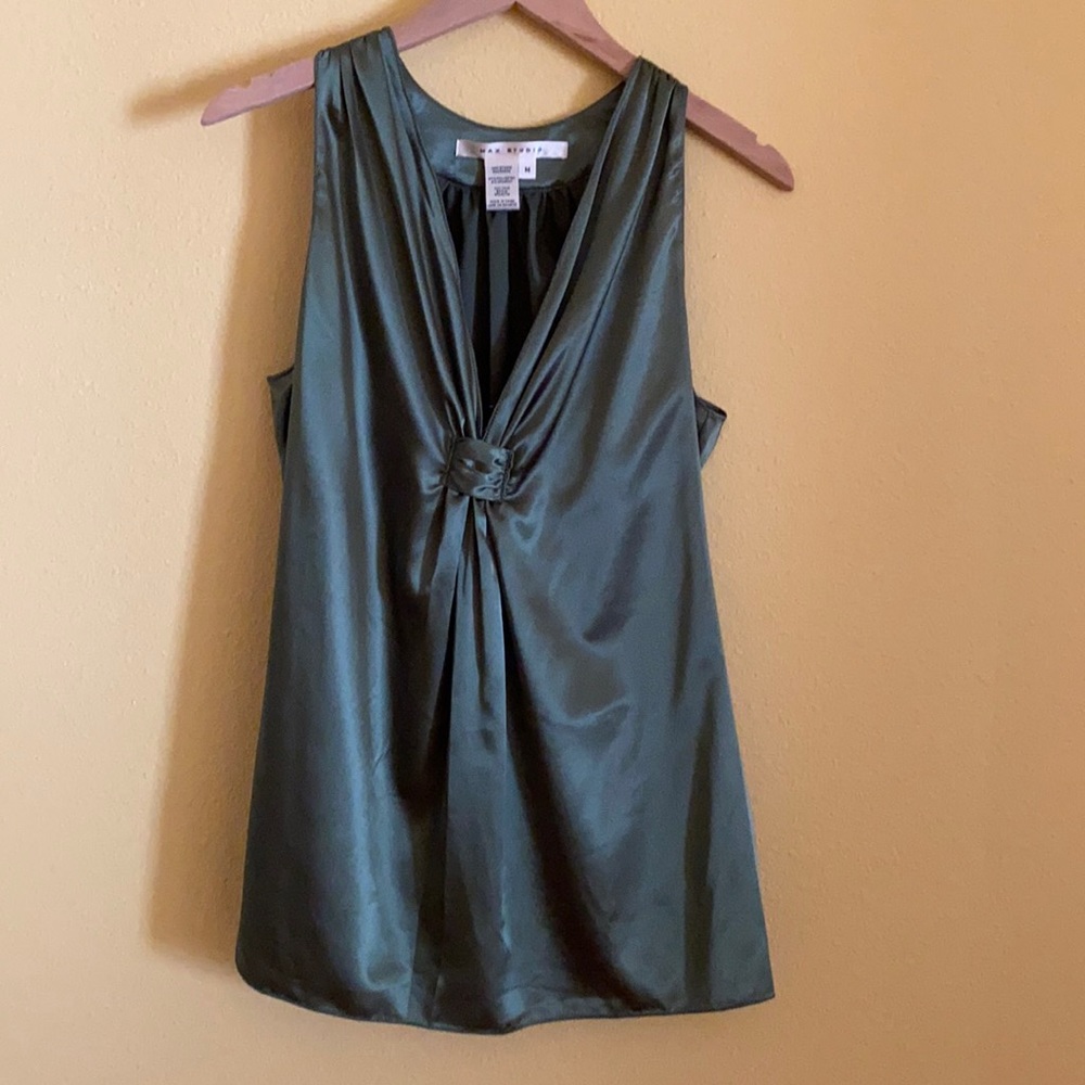 Sleeveless V-neck shell in mossy green.